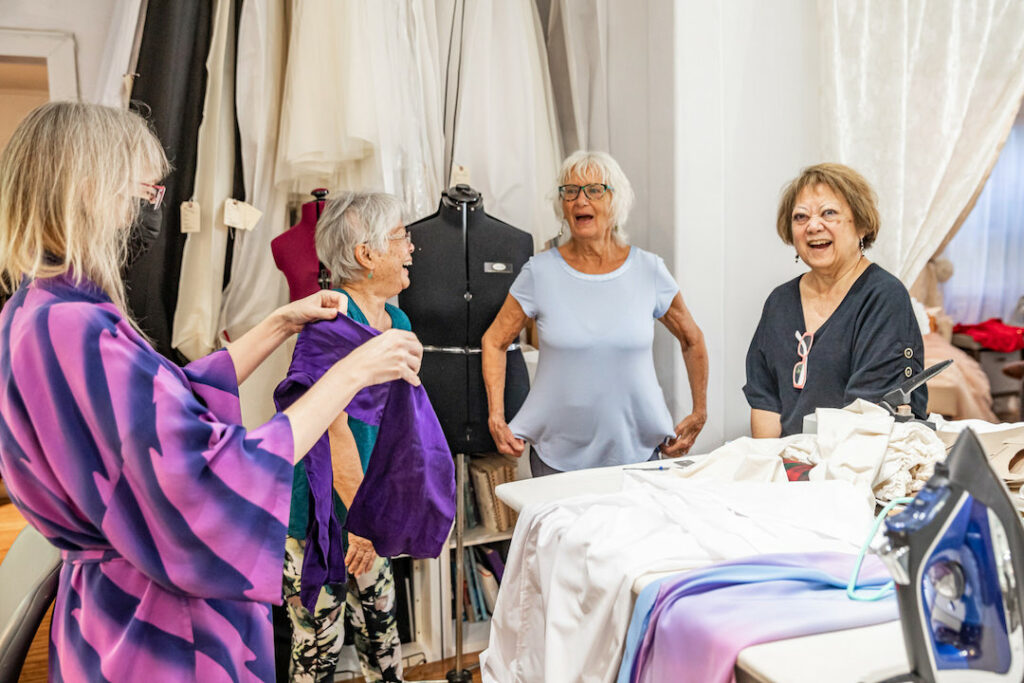 Volunteering visitors and locals at The Sewing Hui of Maui