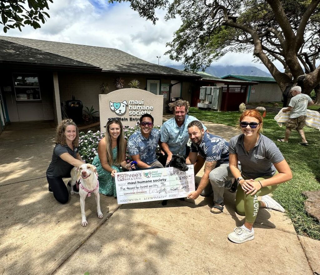 Three's Bar & Grill donates a check to Maui Humane Society from its Kama‘āina Giveback Program